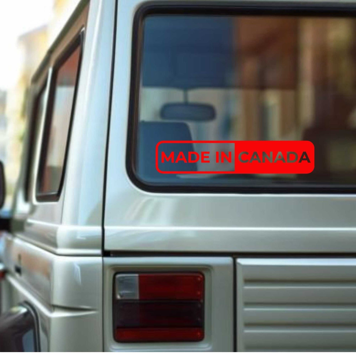 Canadian pride car window sticker with bold red "Made in Canada" text.