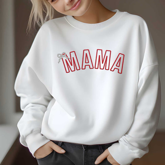 Custom embroidered "MAMA" sweatshirt, featuring red text and bow detail, worn by a model; available in various sizes and colors.