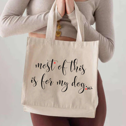 Eco-friendly canvas tote bag with "Most of this is for my dog...ALL" quote, ideal for dog lovers carrying pet essentials.