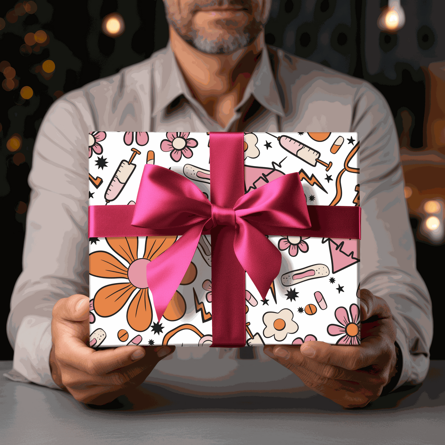 nurse themed gift wrapping paper with pink bow