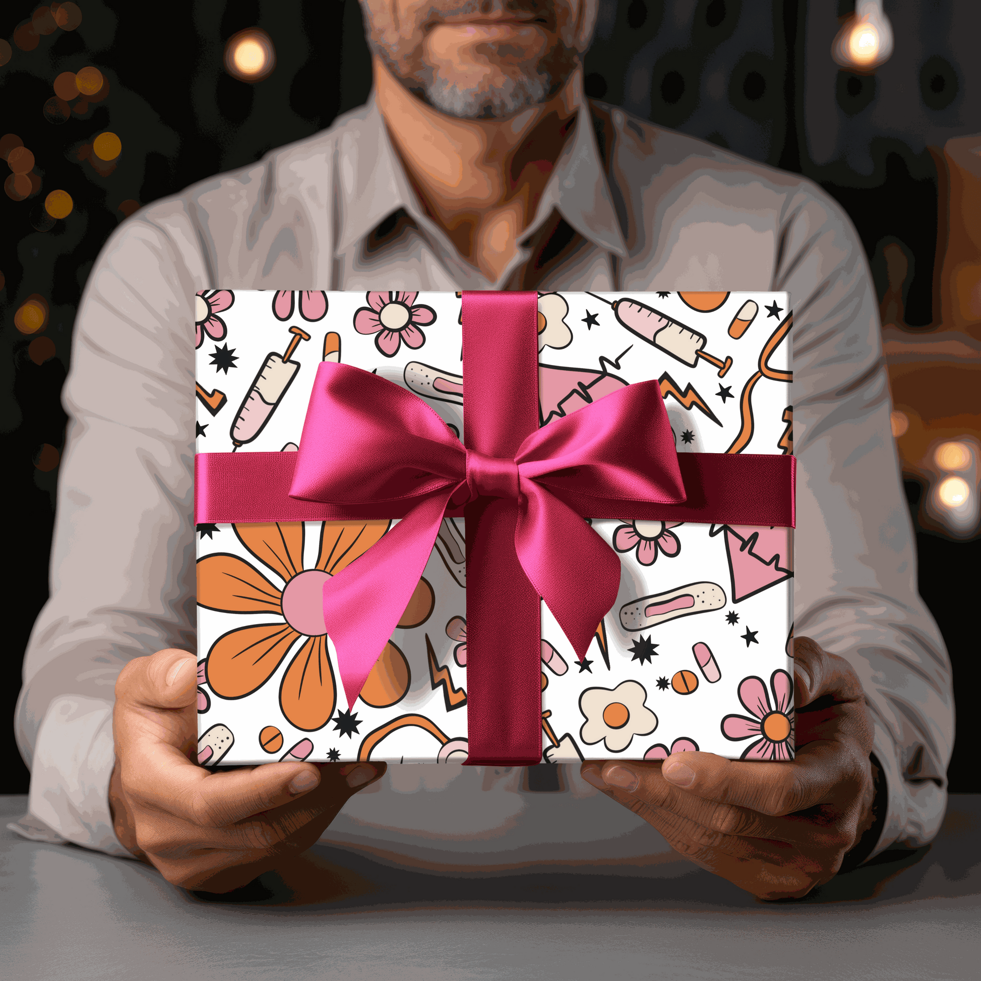 nurse themed gift wrapping paper with pink bow