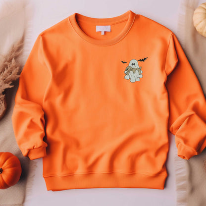 Halloween crewneck sweatshirt with embroidered ghost and dog design in orange, unisex sizing.