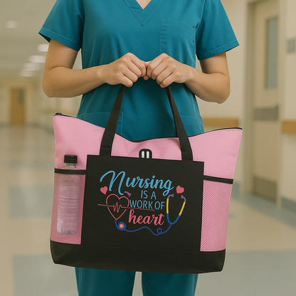 Nursing Is A Work of Heart Embroidered Tote Bag in pink with mesh side pocket and nurse-themed design.