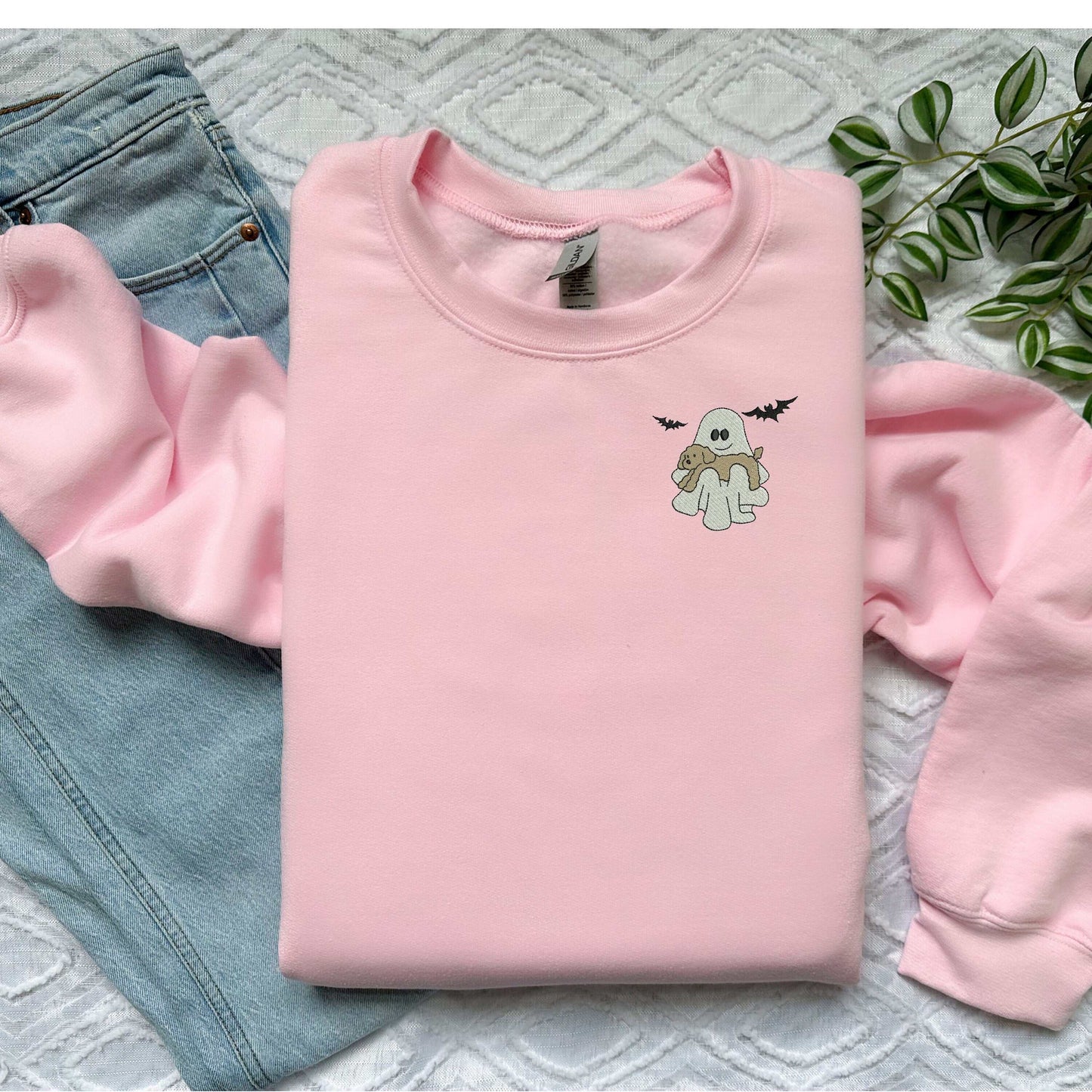 Halloween crewneck sweatshirt with ghost and dog embroidery, pink color, unisex sizing.