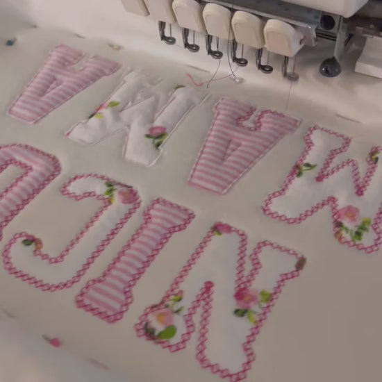 nicu mama sweater made from baby onesies