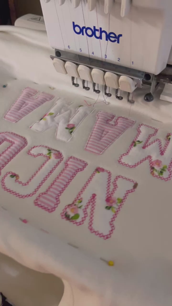 nicu mama sweater made from baby onesies