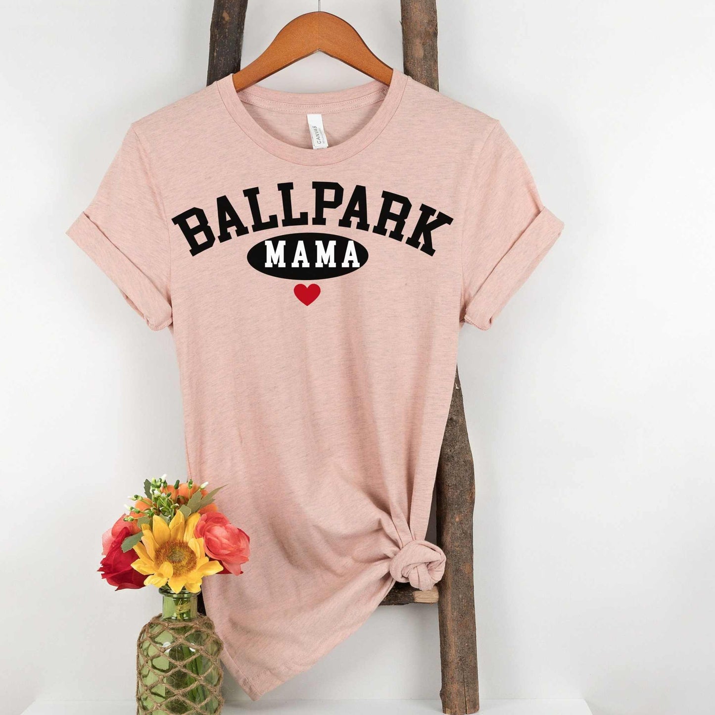 Ballpark Mama Baseball T-Shirt with bold text and heart graphic, unisex sizing, ideal for game-day style and comfort.