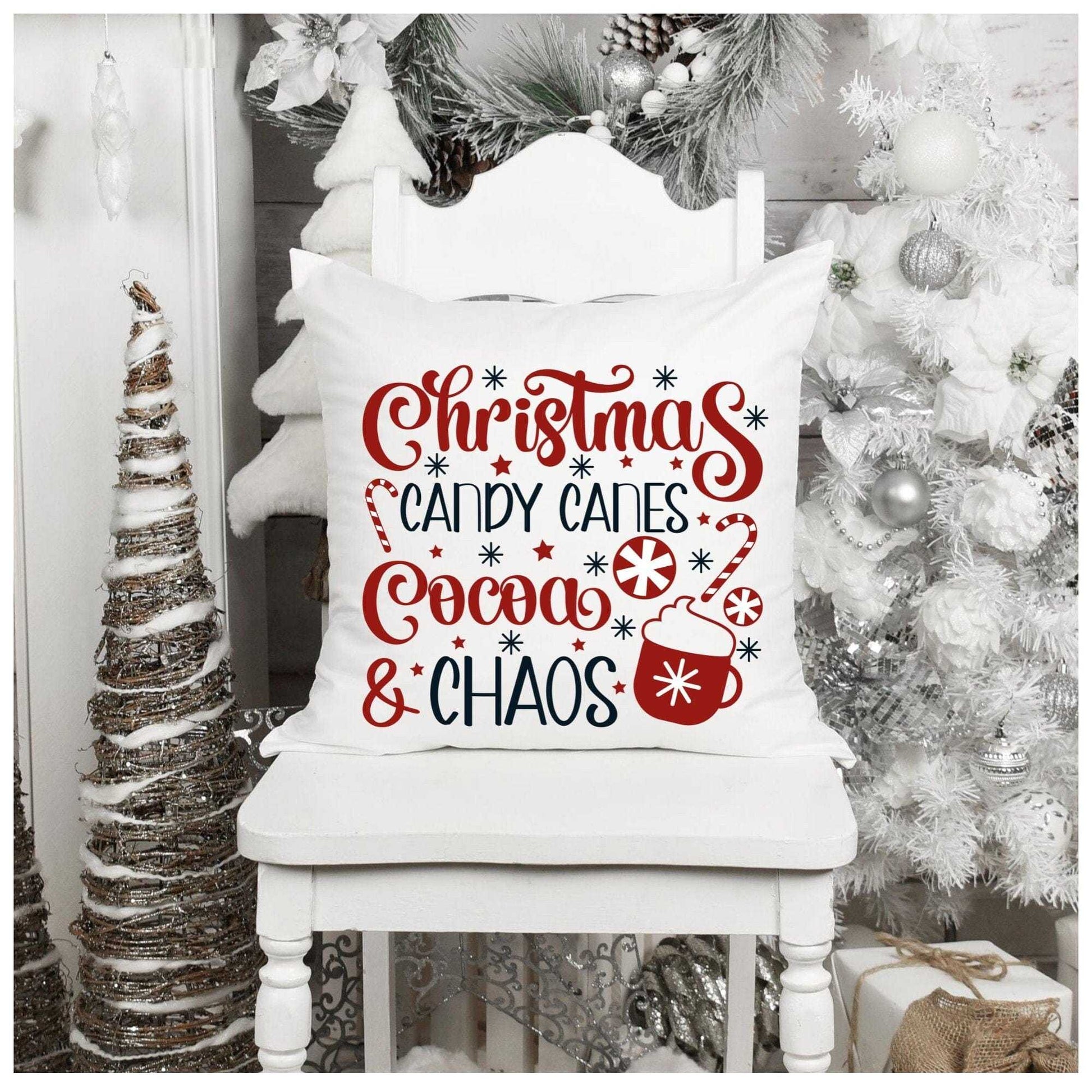Christmas themed throw pillow with festive design of candy canes and cocoa; perfect for holiday home decor.
