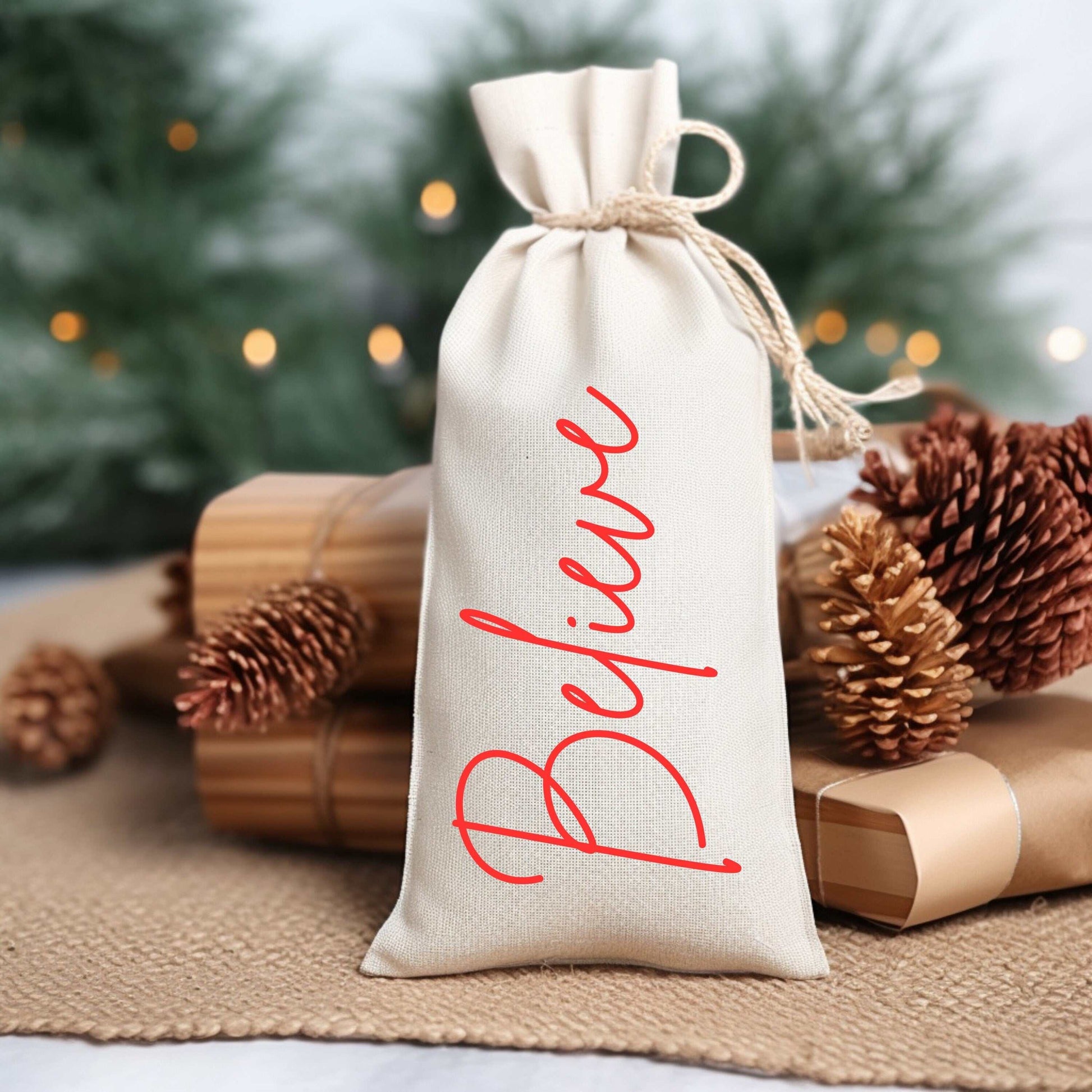 Personalized holiday wine bag made of durable canvas, perfect Christmas gift idea featuring the word "Believe".