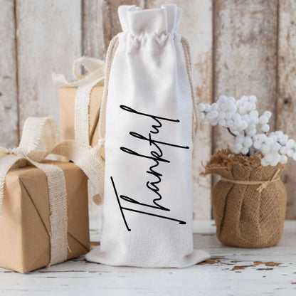 Custom holiday wine bag personalized with "Thankful" text, made of canvas, ideal wine gift for the festive season.