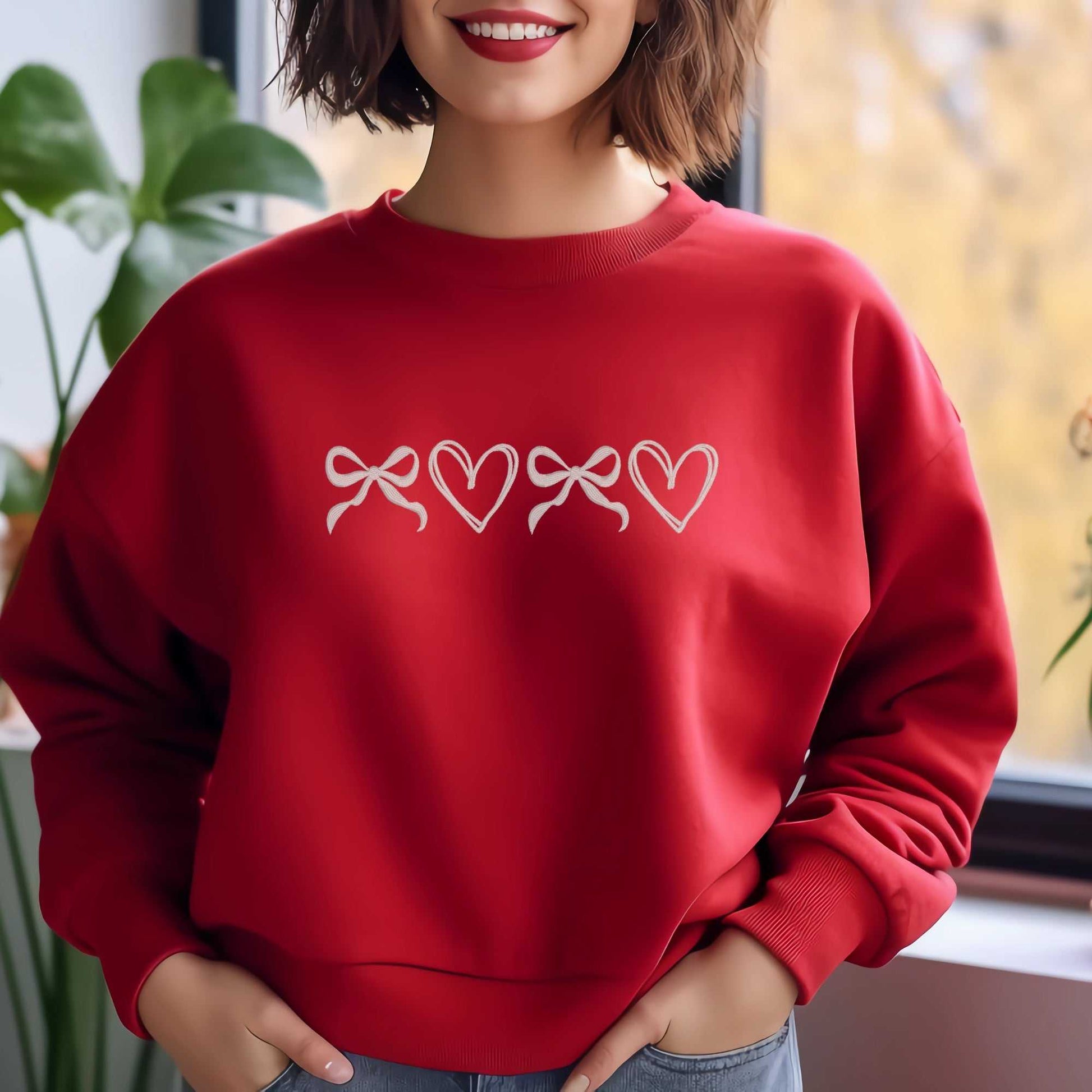 Custom red coquette sweatshirt with embroidered bows and hearts design.