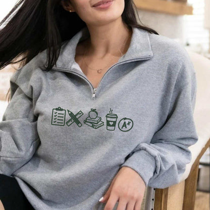 Teacher icon embroidered sweater with school-themed quarter zip pullover and cozy teacher sweatshirt design
