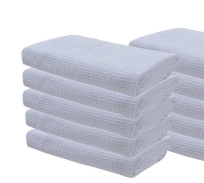 Stack of white waffle weave kitchen tea towels