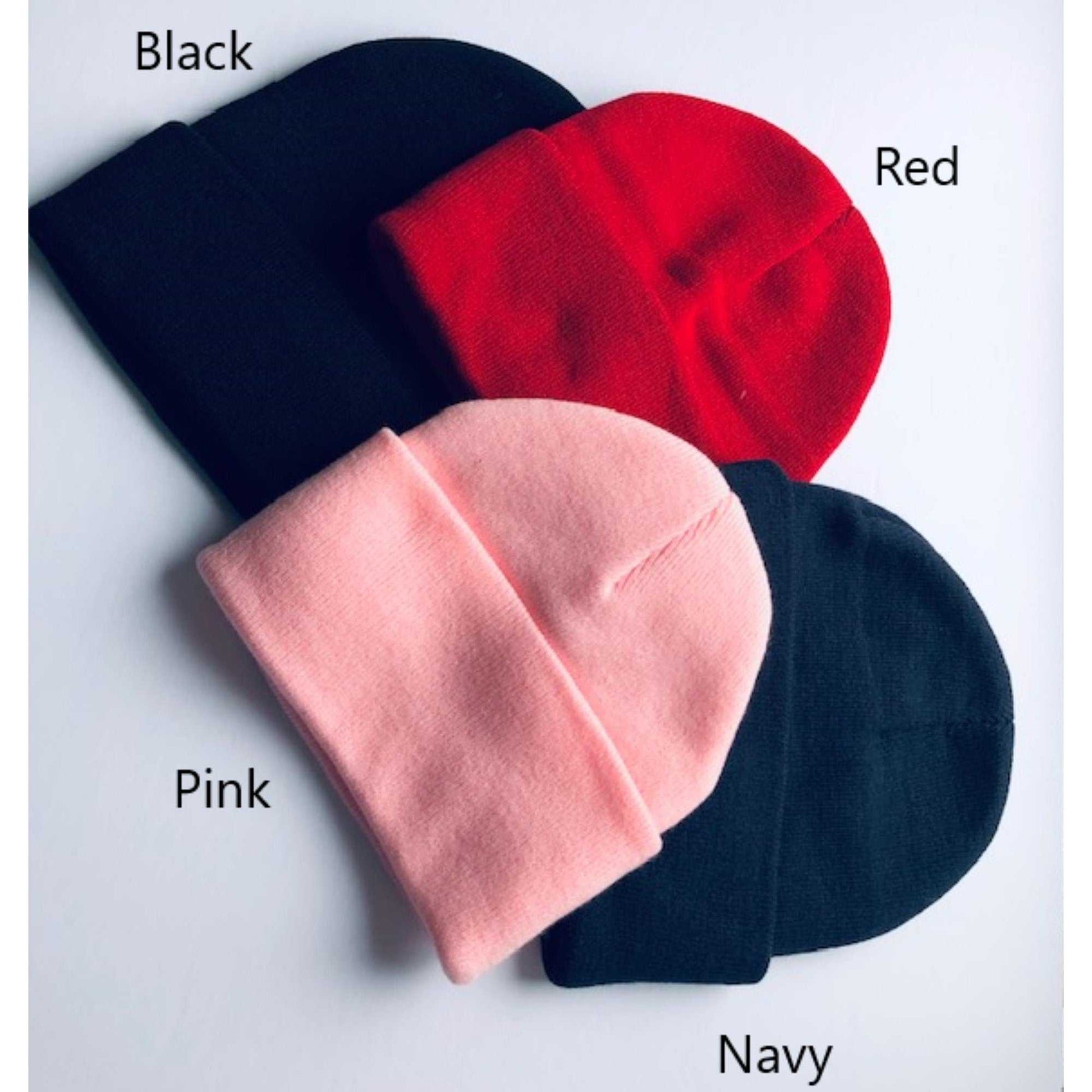 Custom embroidered initial beanie in black, red, pink, and navy.