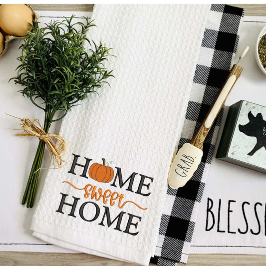 Thanksgiving-themed embroidered tea towel with "Home Sweet Home" text and pumpkin design, 100% cotton kitchen decor, 19x28 inches, ultra absorbent and machine washable.