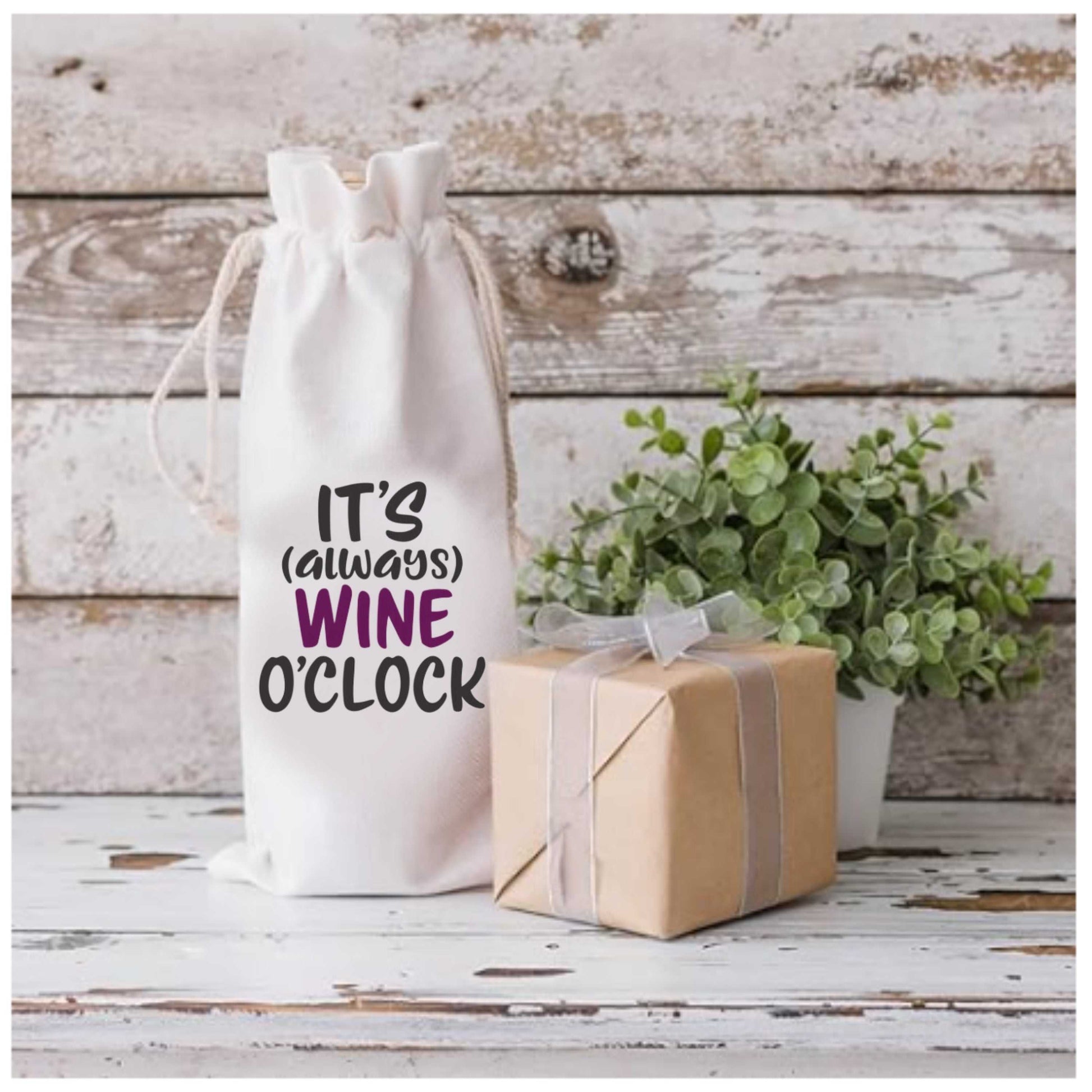 Cotton wine gift bag with "It's Always Wine O'Clock" design, featuring drawstring closure, gift-ready packaging, on rustic background.