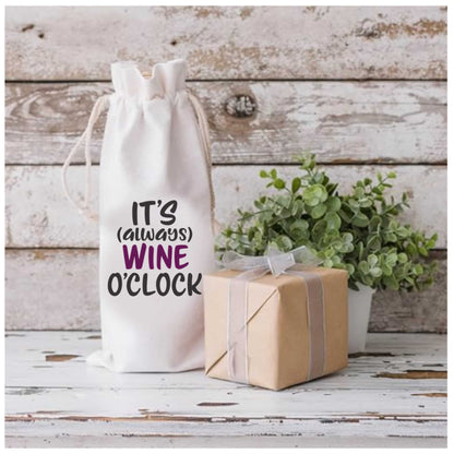 Cotton wine gift bag with "It's Always Wine O'Clock" design, featuring drawstring closure, gift-ready packaging, on rustic background.