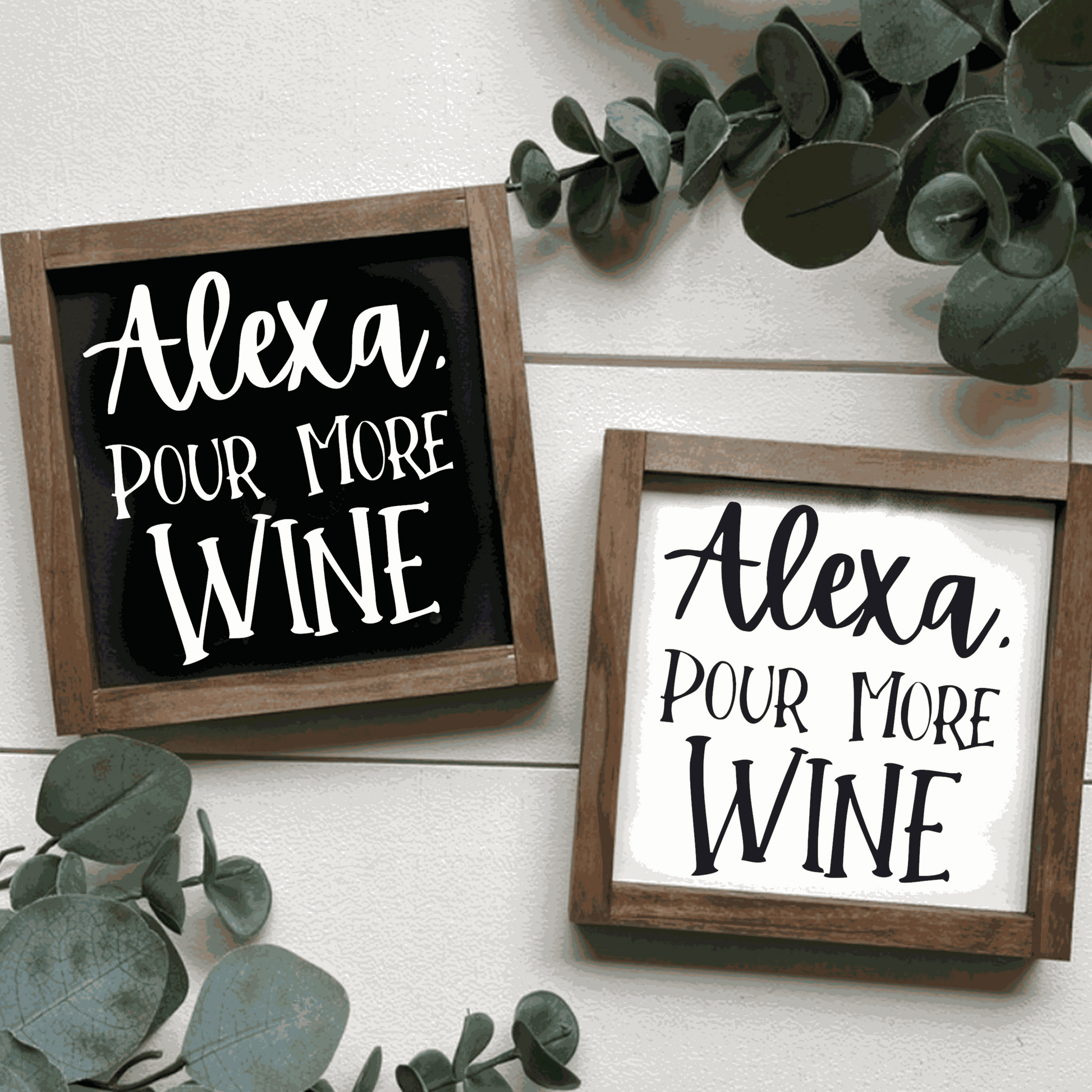 Handcrafted "Alexa Pour More Wine" wood signs with black or white backgrounds and contrasting lettering, framed in stained wood.