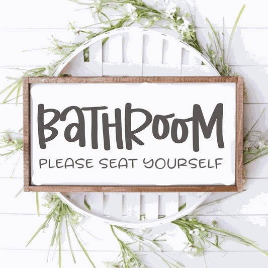 Bathroom Please Seat Yourself framed wood sign with rustic design, sits on decorative background.