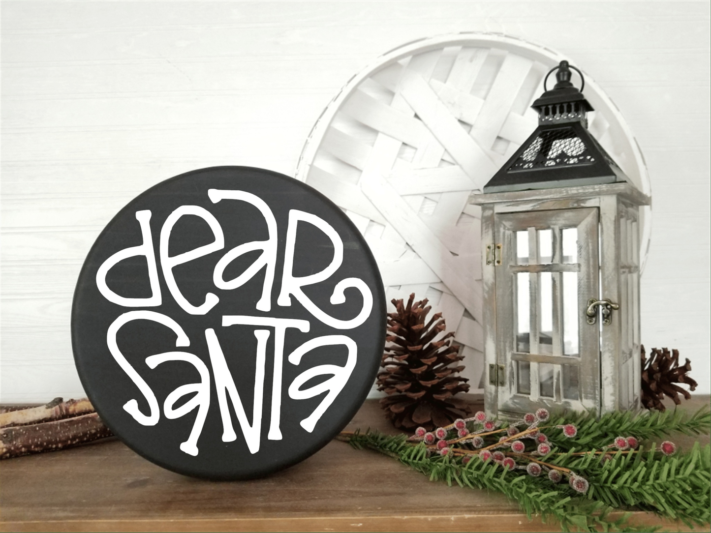 Dear Santa wood sign on a shelf with holiday decor.
