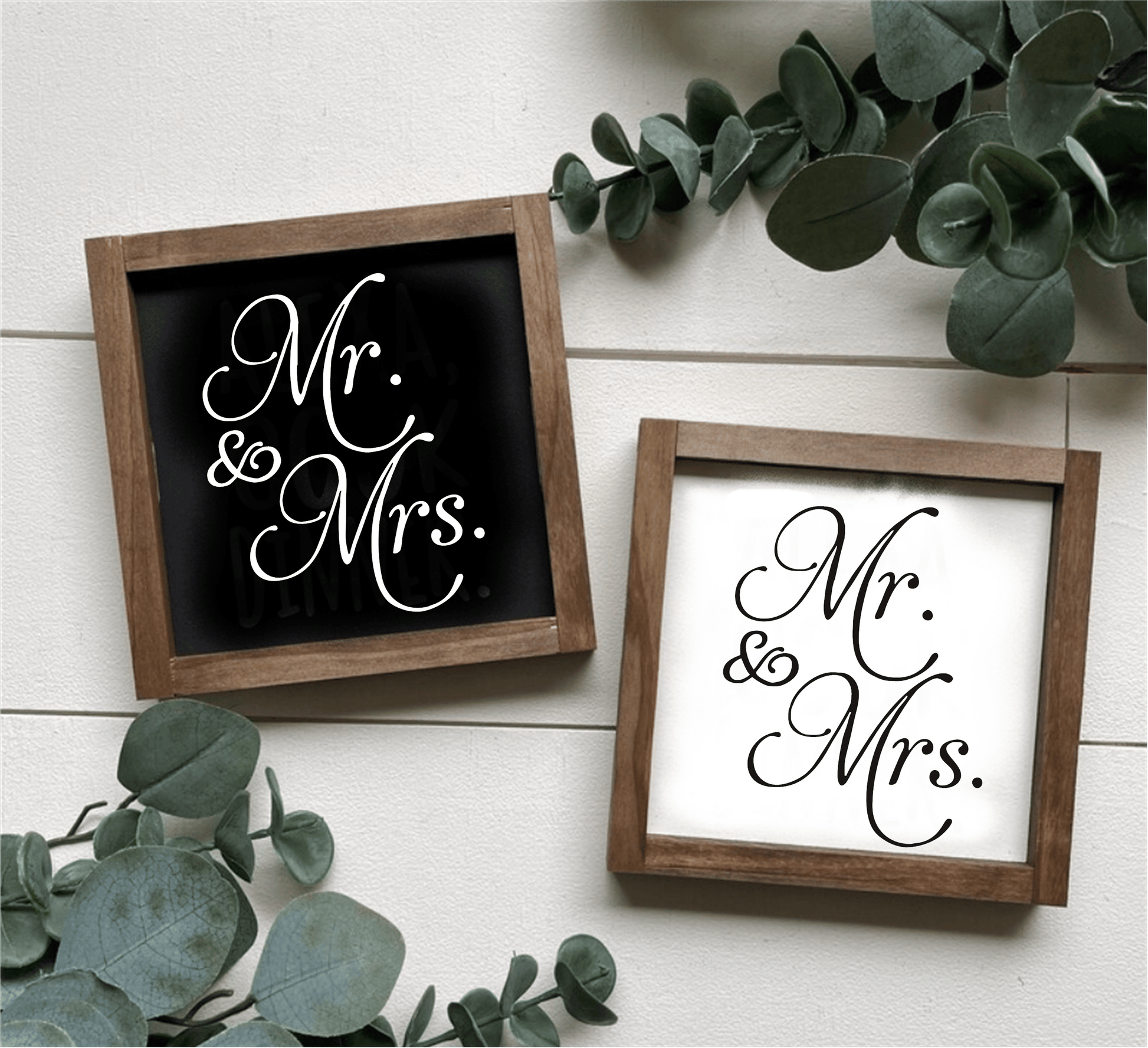 Handcrafted "Mr and Mrs" framed wood signs in black and white backgrounds with leafy decor.