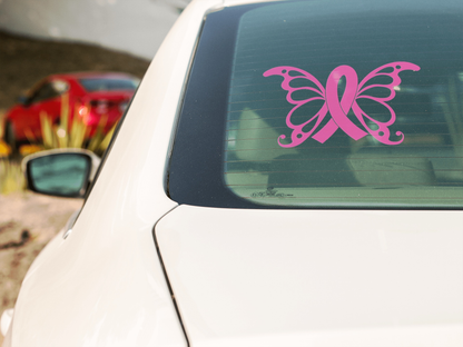 Pink butterfly cancer awareness car sticker on rear window of white vehicle.