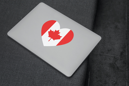 Canada Flag Sticker on a laptop, featuring a heart-shaped design with a maple leaf, showcasing Canadian pride.