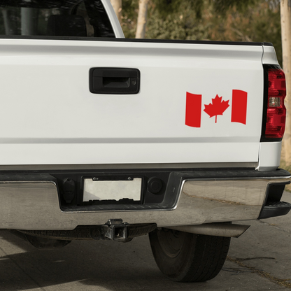 Canadian flag decal sticker on white truck tailgate, showcasing Maple Leaf design.