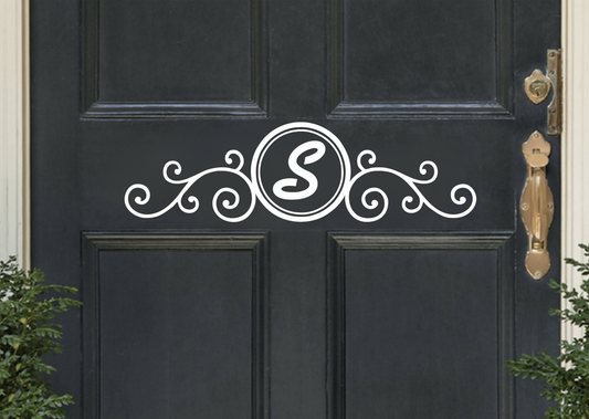 Personalized monogram front door decal with decorative design on a black door.