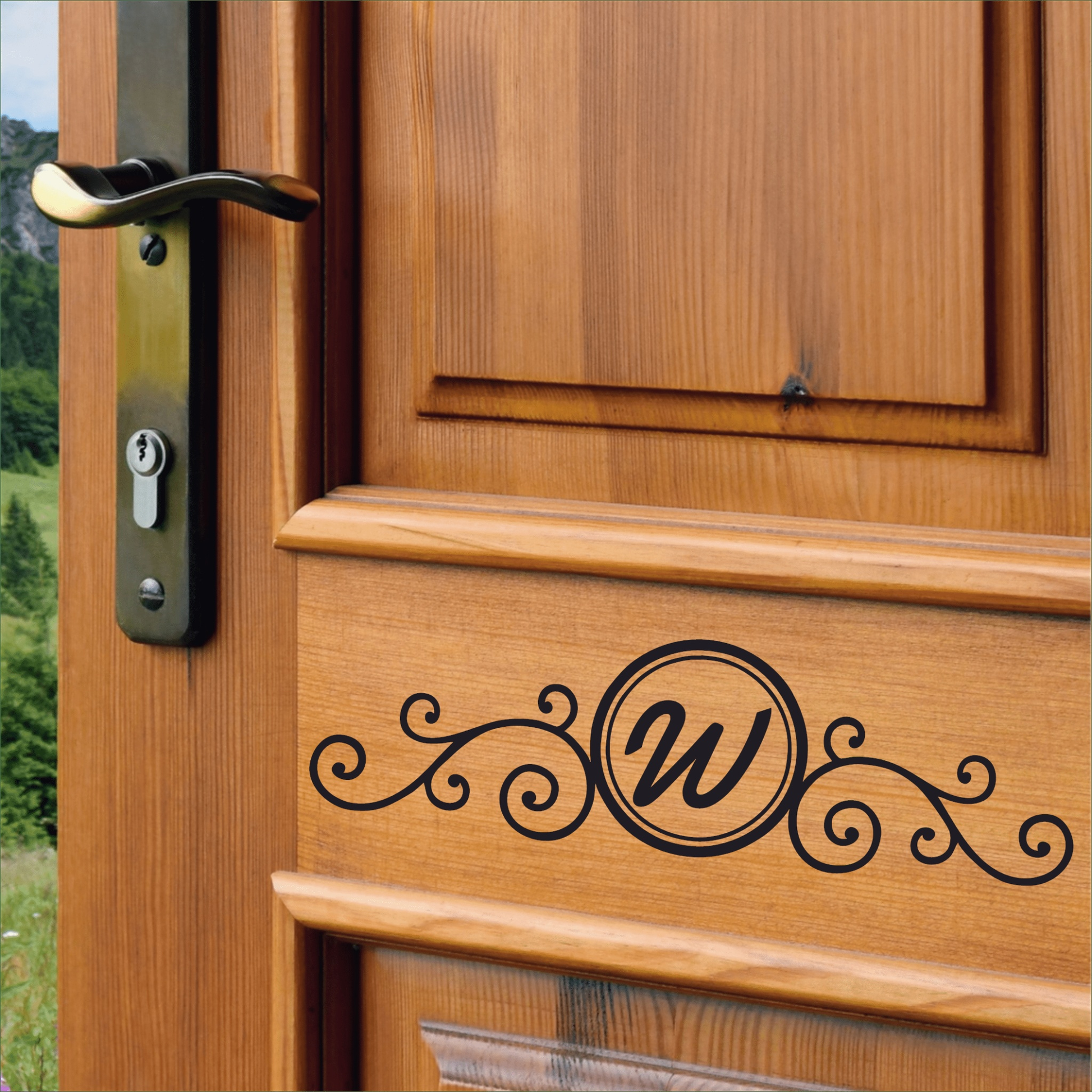 Custom monogram front door decal on wooden door.