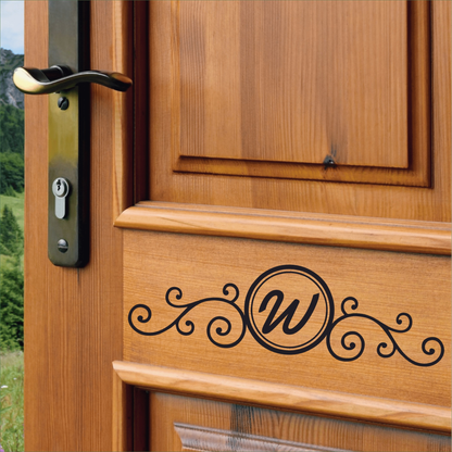 Custom monogram front door decal on wooden door.