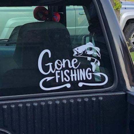 Gone Fishing vinyl decal on car window, perfect for fishermen, adds personality to vehicles and more.