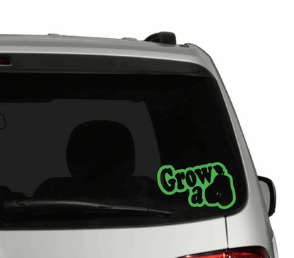 Vinyl car sticker with "Grow a Pear" design on vehicle window.