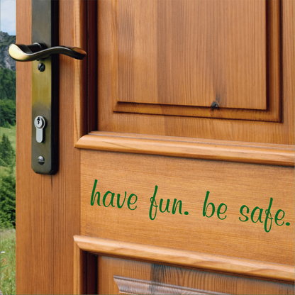 Have Fun be Safe vinyl door decal on wooden door interior.