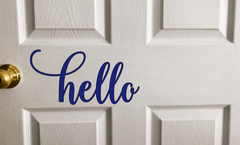 Vinyl door decal with "hello" text on white door.