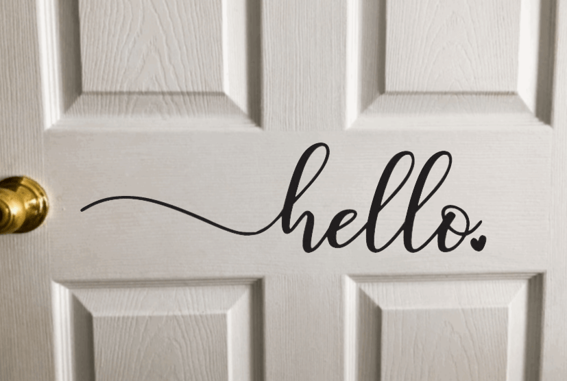 Hello Vinyl Door Decal on a wooden door, perfect for welcoming guests, easy peel and stick application.