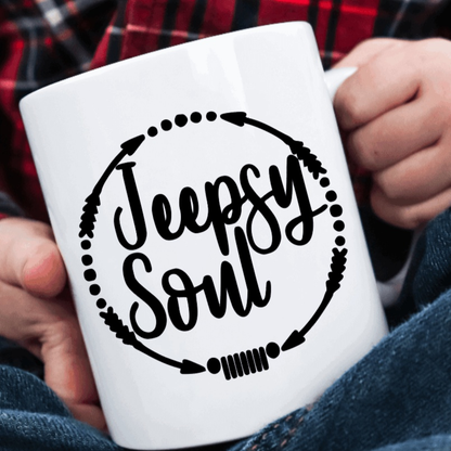 Jeepsy Soul Vinyl Decal on coffee mug held by person in plaid shirt.
