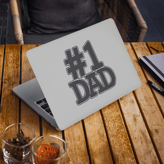 Number One Dad Sticker decal on a laptop placed on a wooden table