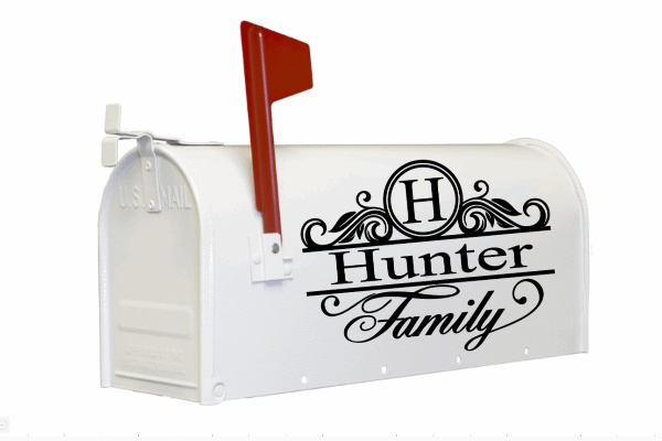 Custom vinyl mailbox decals with decorative name and initial design on a white mailbox.