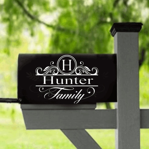 Custom mailbox vinyl decals on a black mailbox with "H" and "Hunter Family" design.