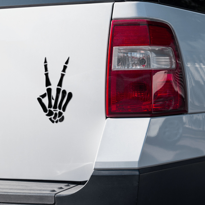 Skeleton hand peace sign decal sticker on a car.
