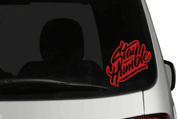 Stay Humble car decal on rear window with colored background, outdoor gloss finish vinyl.