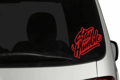 Stay Humble car decal on rear window with colored background, outdoor gloss finish vinyl.