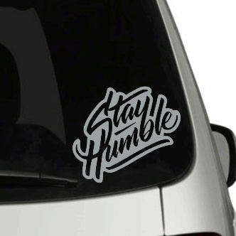 Stay Humble personalized car decal with colored background on vehicle window.