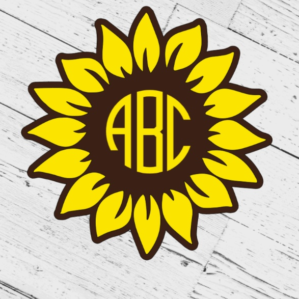 Sunflower vinyl monogram decal on wood background.