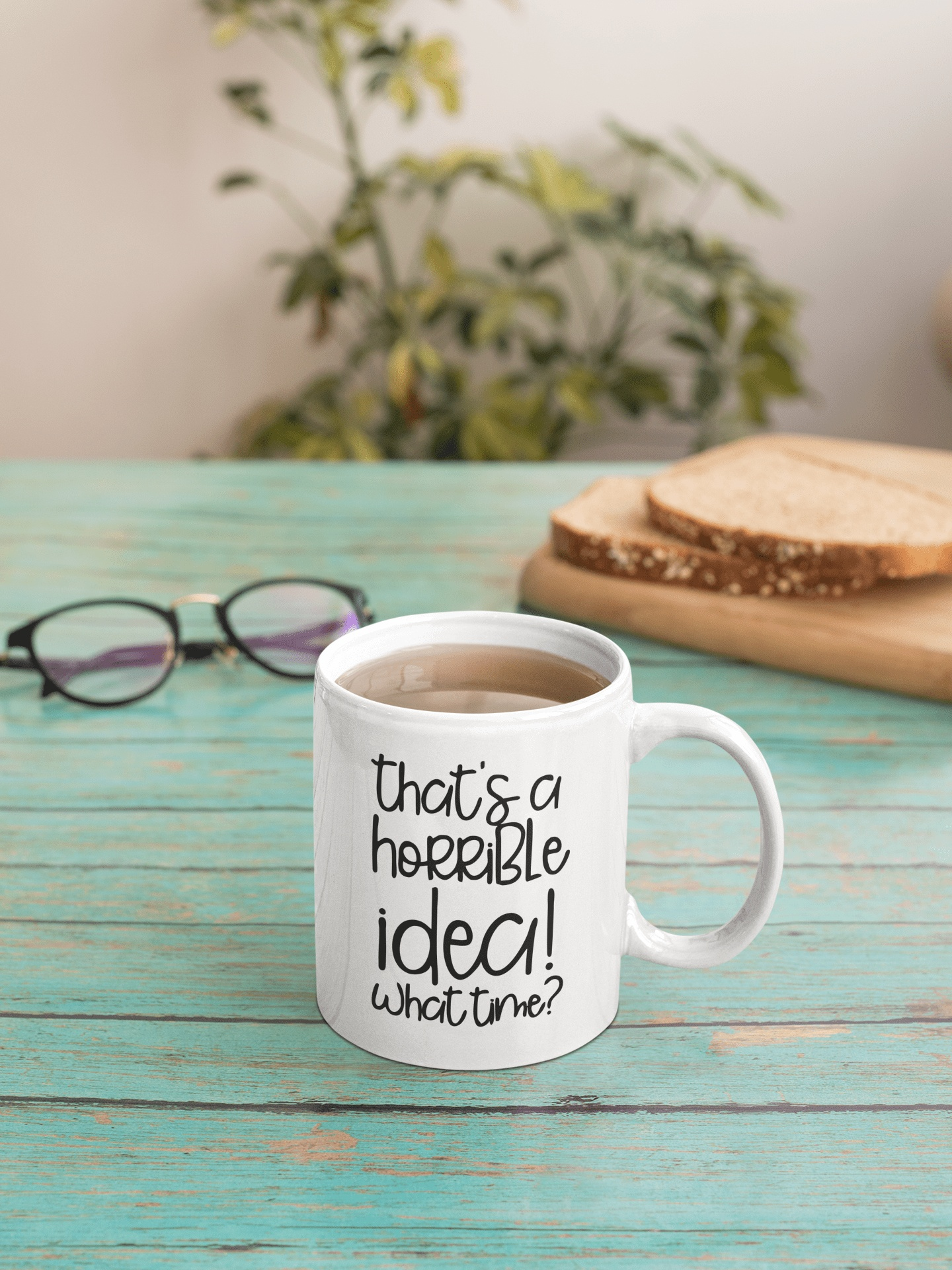 Funny ceramic mug with "That's a Horrible Idea, What Time?" text design.