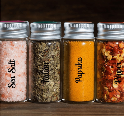 Custom vinyl decals on spice jars labeled with Sea Salt, Italian, Paprika, and Pepper.