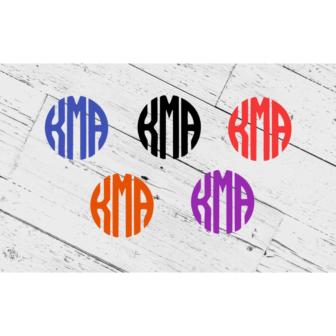 Colorful vinyl monogram decals in different hues on a wooden surface, suitable for personalization and outdoor use.