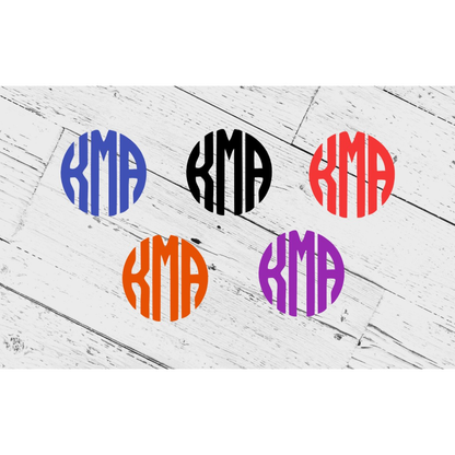 Colorful vinyl monogram decals in different hues on a wooden surface, suitable for personalization and outdoor use.