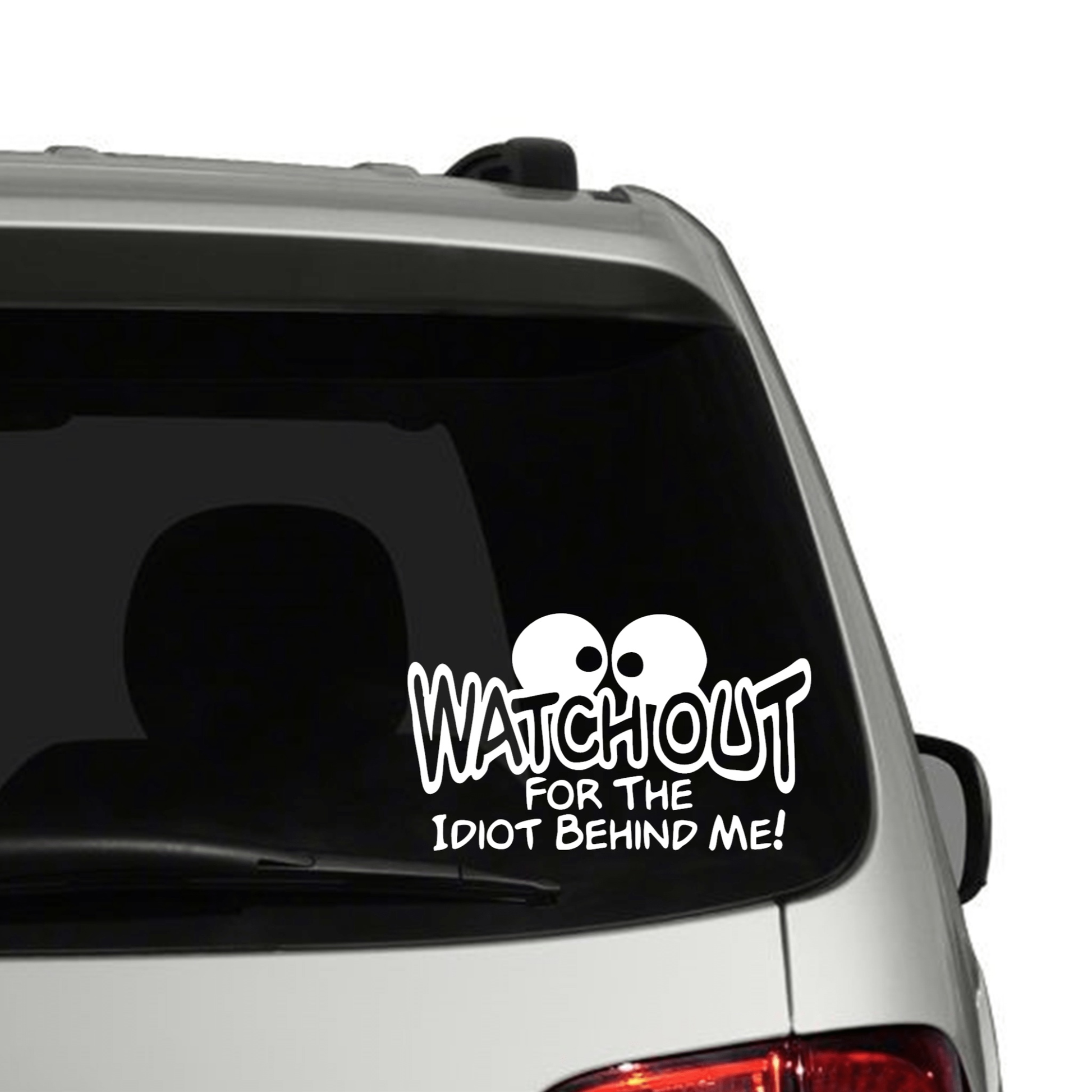 "Watchout for the Idiot Behind Me" car decal on rear window.